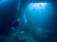 Divers in a cavern